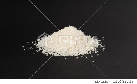 Grated coconut powder. Dry coco flakes pile, shredded desiccated coconut, tropical fruit chips Grated coconut powder. Dry coco flakes pile, shredded desiccated coconut, tropical fruit chips 139582315