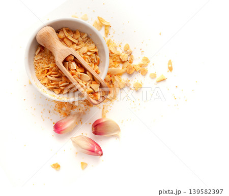 Dry Garlic Slices, Crispy Fried Cloves Pile Closeup, Roasted Grilled Garlic Flakes, Clove Chip Group Dry Garlic Slices, Crispy Fried Cloves Pile Closeup, Roasted Grilled Garlic Flakes, Clove Chip Group 139582397