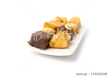 Baklava Isolated, Small Ramadan Dessert, Eastern Sweet Filo Pastries, Turkish Honey Baklawa, Oriental Desert Baklava Isolated, Small Ramadan Dessert, Eastern Sweet Filo Pastries, Turkish Honey Baklawa, Oriental Desert 139582696