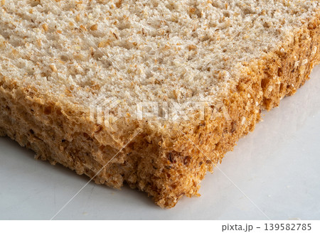 Bread slice macro texture, baked dough pattern Bread slice macro texture, baked dough pattern 139582785