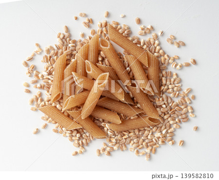 Raw Brown Pasta, Wholegrain Penne, Dry Whole Grain Noodle, Raw Spelt Macaroni, Healthy Italy Food Raw Brown Pasta, Wholegrain Penne, Dry Whole Grain Noodle, Raw Spelt Macaroni, Healthy Italy Food 139582810