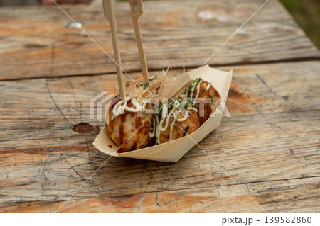 Takoyaki - traditional Japanese street food, outdoor snack with octopus Takoyaki fried balls Takoyaki - traditional Japanese street food, outdoor snack with octopus Takoyaki fried balls 139582860