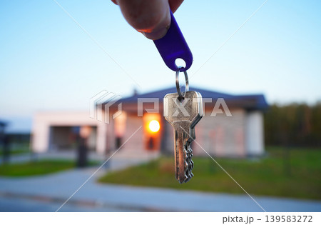 Keys for new house. Keys for  house facade after buying. Buying suburb home 139583272