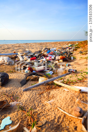 Trash on beach at sea. Garbage dump at ocean. Trash, debris on sea beach. Littered shore. Trash on beach at sea. Garbage dump at ocean. Trash, debris on sea beach. Littered shore. 139583306