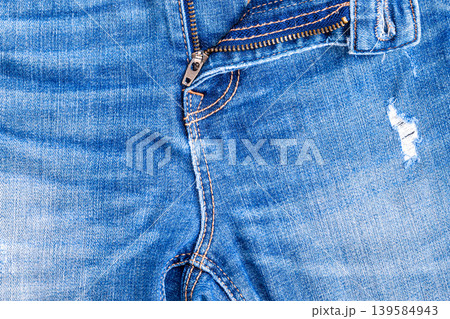 Blue Jeans with Open Metal Zipper and Button Detail Blue Jeans with Open Metal Zipper and Button Detail 139584943
