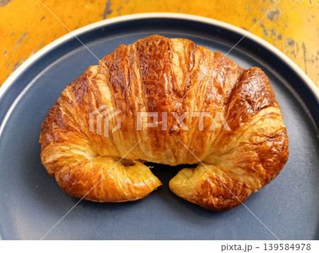 Delicious homemade chocolate filled croissants served on a plate. Delicious homemade chocolate filled croissants served on a plate. 139584978