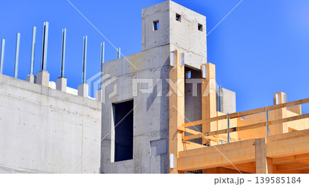 Laminate wood floors and supports of a mass timber multi story green, sustainable office building construction project. The building structure also has concrete walls. 139585184