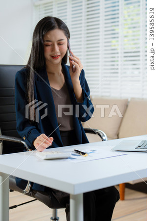 women talk mobile phones appointment reminders in calendar on interface. working on laptop computers, online business. 139585619