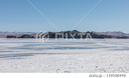 Frozen Lake Baikal Maloye More with rocky island and winter ice panorama Frozen Lake Baikal Maloye More with rocky island and winter ice panorama 139586449