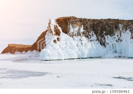 Winter ice formations on rocky shore of Lake Baikal, Russia at sunrise Winter ice formations on rocky shore of Lake Baikal, Russia at sunrise 139586461