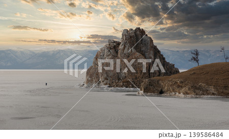 Shaman Rock at sunset on frozen Lake Baikal near Khuzhir village, Russia 139586484