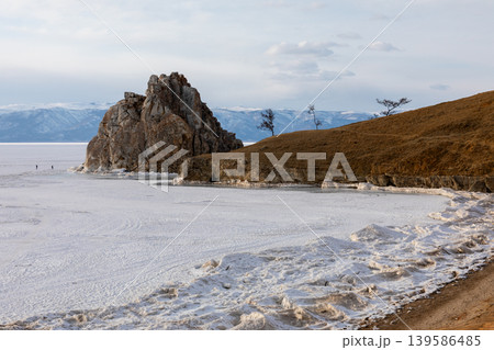 Shamanka Rock on frozen Lake Baikal near Khuzhir village, Olkhon Island Shamanka Rock on frozen Lake Baikal near Khuzhir village, Olkhon Island 139586485