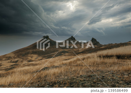 Storm clouds over Khorgoy Cape steppe hills on Lake Baikal, Russia landscape 139586499