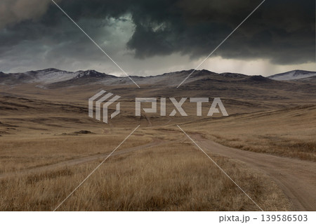 Storm clouds over steppe road on Olkhon Island landscape, Lake Baikal area 139586503