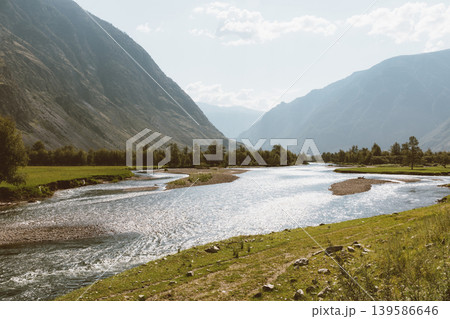 Scenic Chulyshman Valley river landscape with mountains and summer meadow Scenic Chulyshman Valley river landscape with mountains and summer meadow 139586646