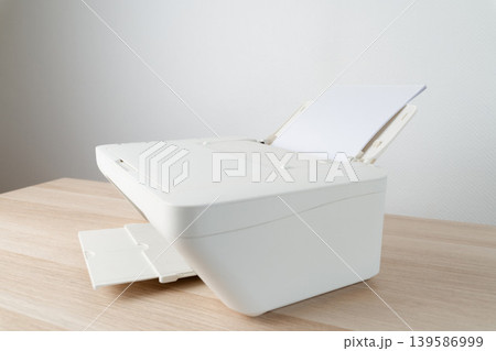 White Office Printer With Blank Paper In Feeder Tray Close-Up For Document Printing And Workspace White Office Printer With Blank Paper In Feeder Tray Close-Up For Document Printing And Workspace 139586999