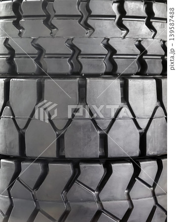 Tires stacked in a warehouse ready for delivery to customers in need of vehicle maintenance Tires stacked in a warehouse ready for delivery to customers in need of vehicle maintenance 139587488