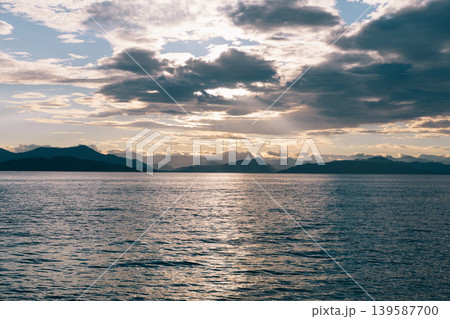 Sunset over Avacha Bay with dramatic clouds and distant mountains, Kamchatka Sunset over Avacha Bay with dramatic clouds and distant mountains, Kamchatka 139587700