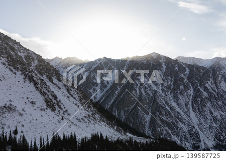 Winter mountain landscape at Ala Archa National Park with snowy ridges at sunrise 139587725