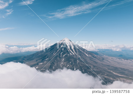 Aerial view of Koryakskaya Sopka volcano above clouds near Petropavlovsk Aerial view of Koryakskaya Sopka volcano above clouds near Petropavlovsk 139587758