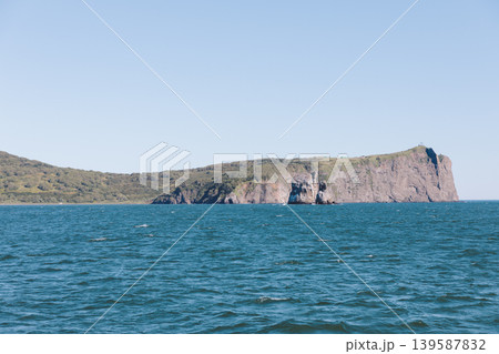 Rocky sea cliffs and coastal headland landscape on Kamchatka Peninsula, Russia Rocky sea cliffs and coastal headland landscape on Kamchatka Peninsula, Russia 139587832