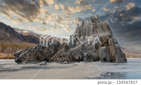 Dramatic ice-covered coastal rock formation on Lake Baikal at winter sunset Dramatic ice-covered coastal rock formation on Lake Baikal at winter sunset 139587857