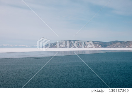 Winter view of Angara River outflow from Lake Baikal with ice and mountains Winter view of Angara River outflow from Lake Baikal with ice and mountains 139587869