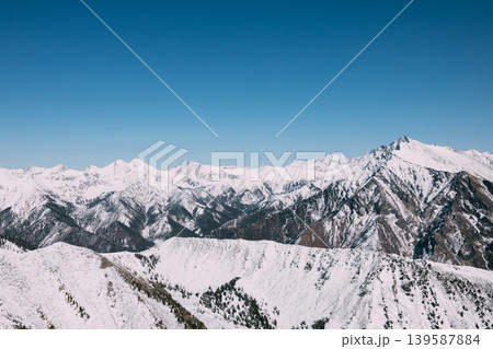 Snowy Sayan Mountains panorama near Arshan with peak Galina under clear sky Snowy Sayan Mountains panorama near Arshan with peak Galina under clear sky 139587884