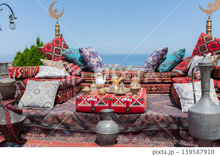 Traditional carpet seating at Naryn-Kala Fortress terrace with sea view in Derbent 139587910