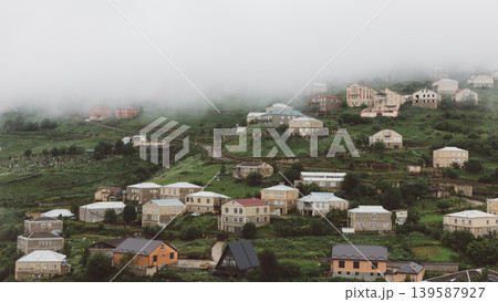 Foggy mountain village landscape with stone houses in Kubachi, Dagestan Foggy mountain village landscape with stone houses in Kubachi, Dagestan 139587927