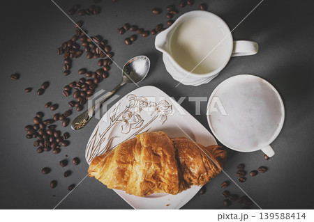 Top view of coffee and croissant with coffee bean Top view of coffee and croissant with coffee bean 139588414