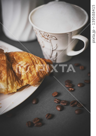 Top view of coffee and croissant with coffee bean 139588415