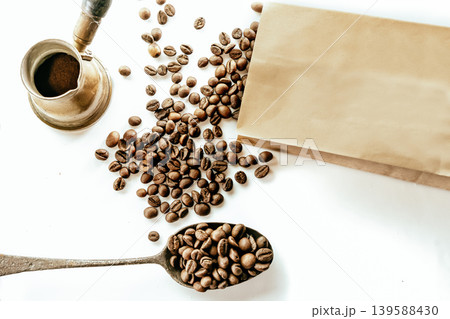 Spoon with instant coffee powder and beans on wooden background, flat lay Spoon with instant coffee powder and beans on wooden background, flat lay 139588430
