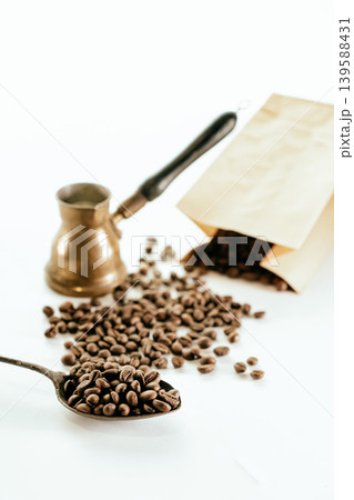 Spoon with instant coffee powder and beans on wooden background, flat lay Spoon with instant coffee powder and beans on wooden background, flat lay 139588431