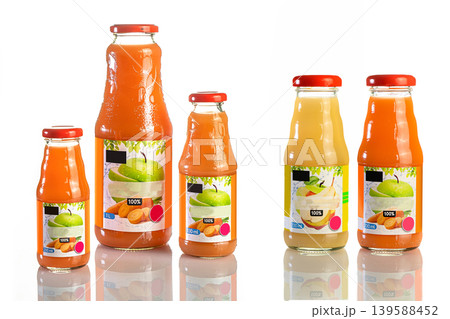 Juice in a glass bottle, bright colored drink on a white background isolated Juice in a glass bottle, bright colored drink on a white background isolated 139588452