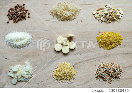 Assorted cereal grain porridge seeds set on a wooden background: buckwheat, rice, semolina, wheat, couscous, oatmeal Assorted cereal grain porridge seeds set on a wooden background: buckwheat, rice, semolina, wheat, couscous, oatmeal 139588480