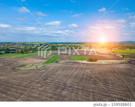 Drone image sunset in clouds with sunrays over road to horizon top wiew Drone image sunset in clouds with sunrays over road to horizon top wiew 139588601
