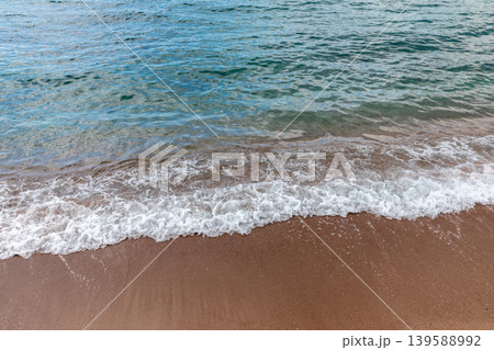 Gentle Adriatic waves on sandy beach near Sveti Stefan, Montenegro coastline Gentle Adriatic waves on sandy beach near Sveti Stefan, Montenegro coastline 139588992