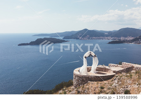 Mountain viewpoint above Sveti Stefan with wedding arch overlooking Adriatic coast Mountain viewpoint above Sveti Stefan with wedding arch overlooking Adriatic coast 139588996