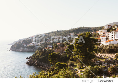 Panoramic coastal view of Old Town Ulcinj with hillside houses and Adriatic Sea Panoramic coastal view of Old Town Ulcinj with hillside houses and Adriatic Sea 139589041