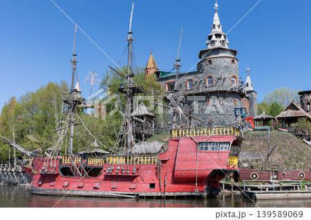 Pirate ship and stone tower at Sonkina Laguna theme park in Satka, Russia Pirate ship and stone tower at Sonkina Laguna theme park in Satka, Russia 139589069