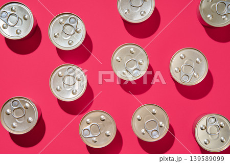 Pattern of metal tin cans on pink background 139589099