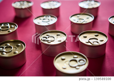 Metal tin cans on pink background 139589100