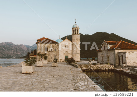 Our Lady of the Rocks church on islet in Perast Bay of Kotor at sunset Our Lady of the Rocks church on islet in Perast Bay of Kotor at sunset 139589221