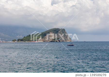 Coastal seascape with rocky peninsula and boat near Budva, Montenegro Coastal seascape with rocky peninsula and boat near Budva, Montenegro 139589270