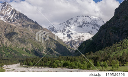 Mount Ullutau sacred peak and glacier valley landscape in the Caucasus mountains Mount Ullutau sacred peak and glacier valley landscape in the Caucasus mountains 139589296