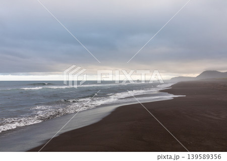 Dramatic black sand shoreline and stormy Pacific seascape at Khalaktyrsky Beach Dramatic black sand shoreline and stormy Pacific seascape at Khalaktyrsky Beach 139589356