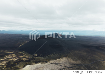 Tolbachinsky Dol Northern Breakthrough volcanic cones under cloudy sky 139589367