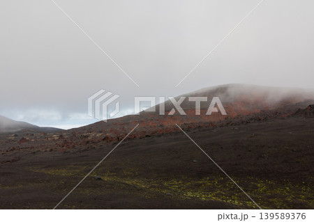 Misty volcanic landscape of Tolbachinsky Dol lava fields in Kamchatka, Russia 139589376