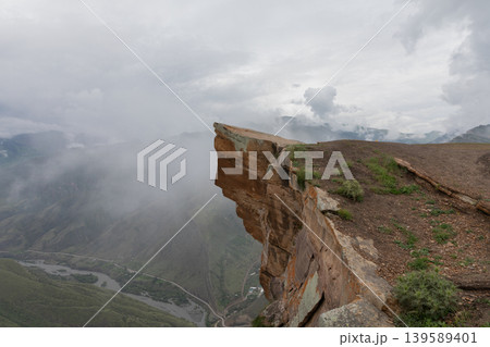 Dramatic cliff viewpoint at Troll Tongue near Old Goor in Dagestan mountains 139589401